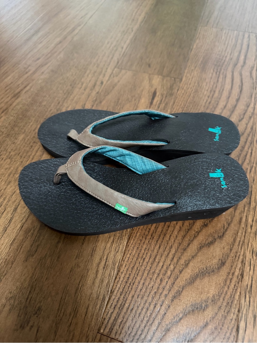 Sanuk Black Sandals with Brown Straps and Teal Accents